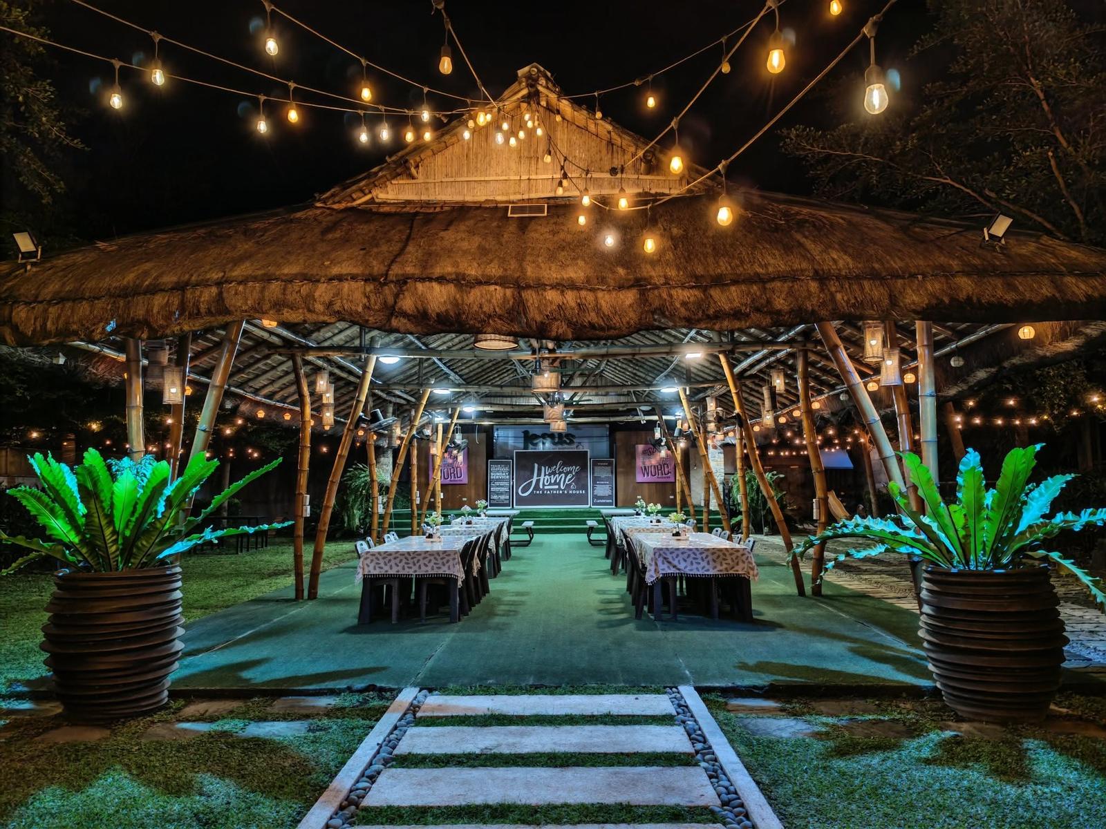 David's Grill dining pavilion set for guests under string lights
