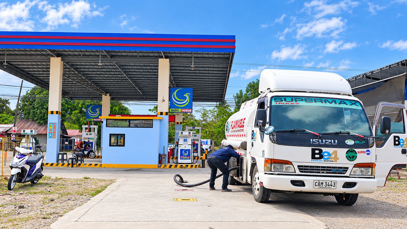 SuperTrio fuel tanker delivering at a gasoline station